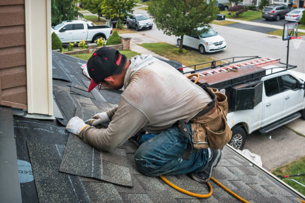 Professional Roofing technician working in Henderson, IL